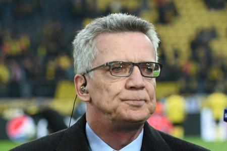 De Maizière verurteilt Fan-Krawalle: De Maizière verurteilt Fan-Krawalle: