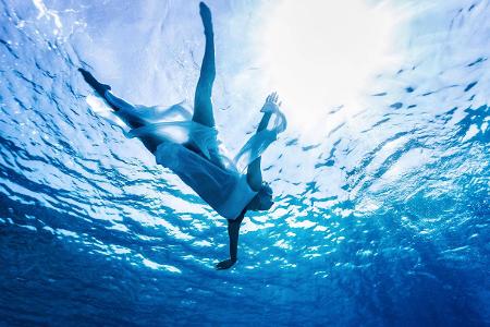 Enjoying refreshing water, silhouette of woman s body in the... Enjoying refreshing water, silhouette of woman s body in the...