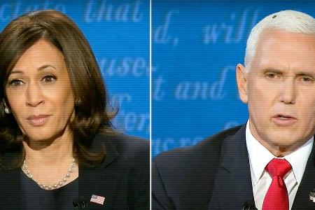 Kamala Harris und Mike Pence - mit Fliege auf dem Kopf - beim TV-Duell Kamala Harris und Mike Pence - mit Fliege auf dem Kopf - beim TV-Duell