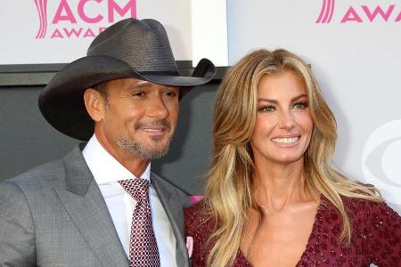 Tim McGraw und seine Frau Faith Hill, die sich in der Country-Sparte weltweit einen Namen gemacht haben Tim McGraw und seine Frau Faith Hill, die sich in der Country-Sparte weltweit einen Namen gemacht haben