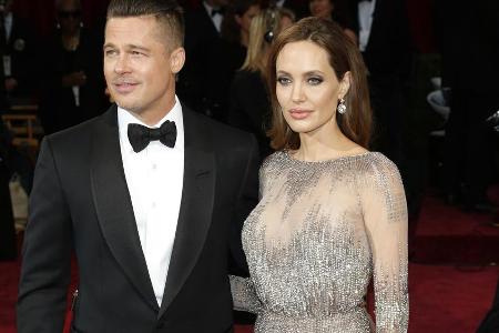 Brad Pitt und Angelina Jolie in glücklichen Tagen bei den Oscars 2014 Brad Pitt und Angelina Jolie in glücklichen Tagen bei den Oscars 2014