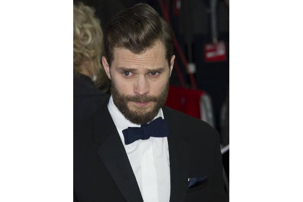 ...männliche Hauptdarsteller Jamie Dornan, der im Film den Millionär Christian Grey spielt. Mit so viel Aufmerksamkeit für s...