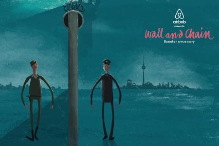 Zwei Grenzwächter an der Berliner Mauer: Einer im Westen, einer im Osten Zwei Grenzwächter an der Berliner Mauer: Einer im Westen, einer im Osten