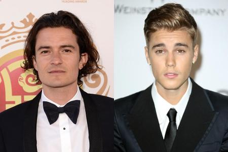 Fans feiern Orlando Bloom (l.) für seine Rangelei mit Justin Bieber Fans feiern Orlando Bloom (l.) für seine Rangelei mit Justin Bieber