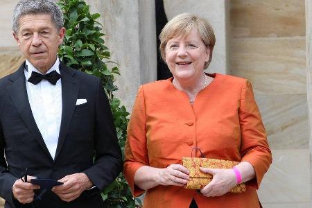 Angela Merkel mit ihrem Ehemann Joachim Sauer bei den Bayreuther Festspielen 2021. Angela Merkel mit ihrem Ehemann Joachim Sauer bei den Bayreuther Festspielen 2021.