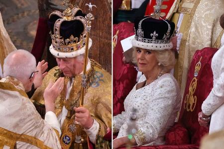 König Charles III. und Königin Camilla kämpfen mit ihren Kronen König Charles III. und Königin Camilla kämpfen mit ihren Kronen