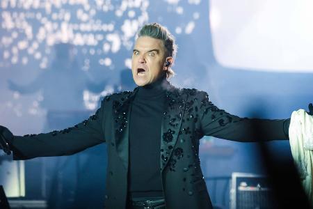 Robbie Williams lässt jahrelangen Streit mit Oasis wieder aufleben Robbie Williams lässt jahrelangen Streit mit Oasis wieder aufleben