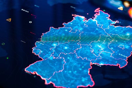 Blaue digitale Karte von Deutschland vor schwarzem Hintergrund