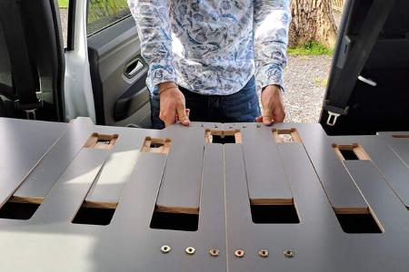 Bett machen im Micro-Camper, seitlich ausziehen