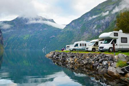Motorhomes at campsite by the Geirangerfjord in Norway Motorhomes at campsite by the Geirangerfjord in Norway